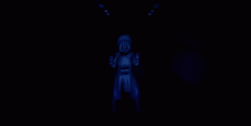 a creepy figure lit by a light in the dark