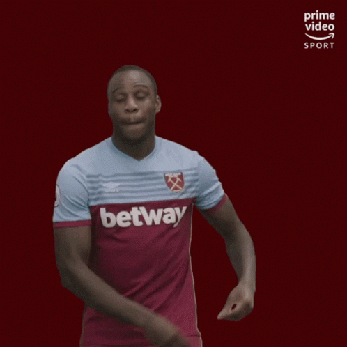 a man in a purple and orange shirt with the words betway on it