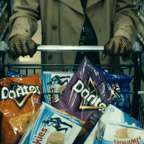 a shopping cart filled with lots of chips