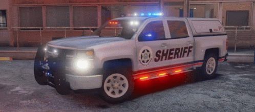 a sheriff truck that has blue lights on