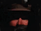 a blurry image of a person wearing a hat