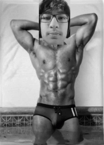 an asian man in his underwear showing his six - pack