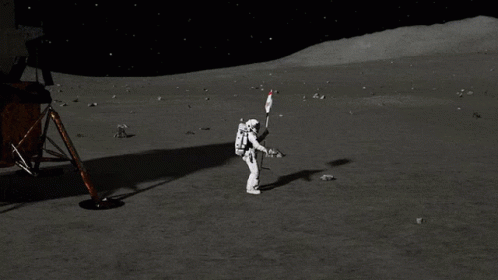 an astronaut is walking towards the camera while on the moon