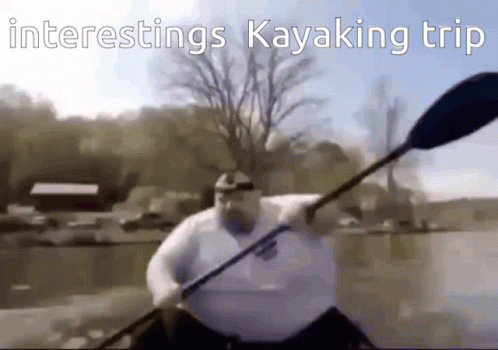 a man paddles a kayak on a river