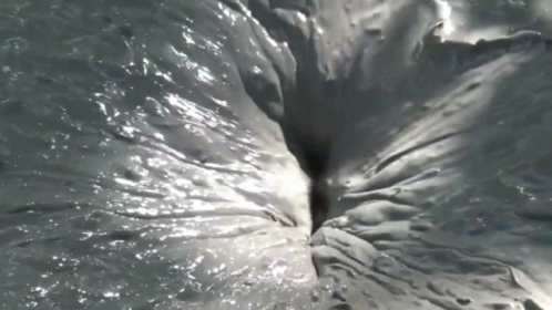 a very close up view of the water of a body of water