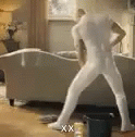 a man in a white uniform is walking through the room