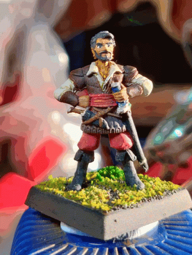 the miniature figurine shows a man holding a sword