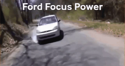 car speeding through the street with ford focus logo