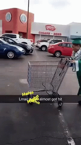 the man in green is holding an empty shopping cart
