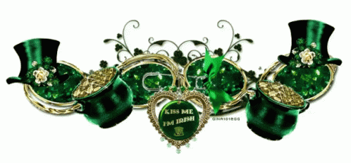 a green and black object with hearts surrounded by ornaments
