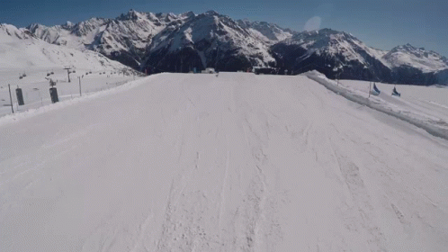 a skier making their way down a ski slope