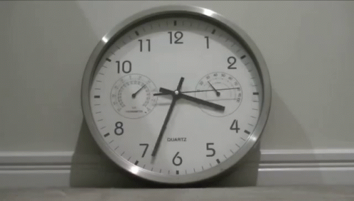 the large clock is pointing the time in different directions