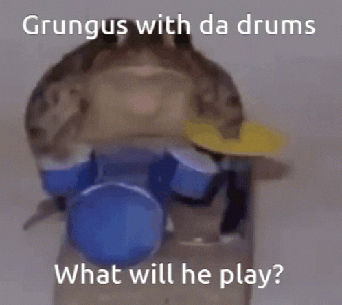 the penguin is sitting on top of a drum