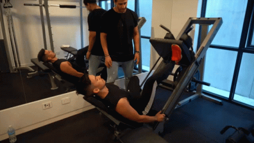 a person in black top is on exercise bench