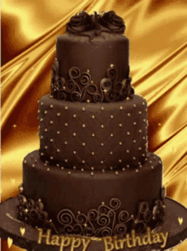 a three tiered cake decorated with icing