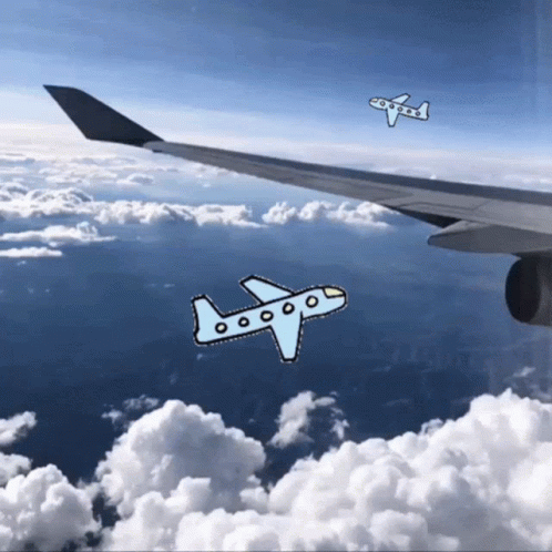 the plane and the airplane are flying over the clouds