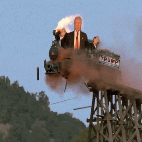 a train traveling through the air with a man on top of it