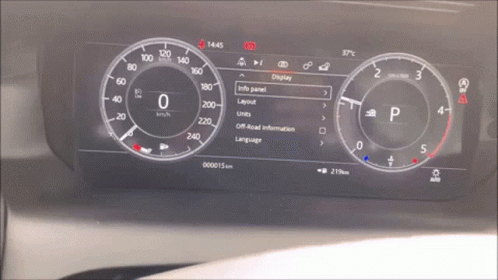 the dashboard of an electric vehicle with multiple gauges