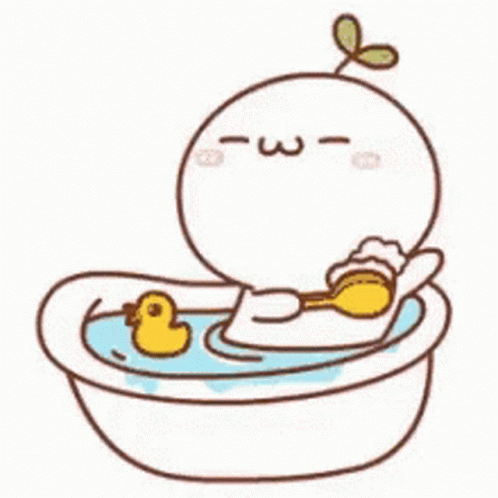 a cute little baby bird sits inside of a bath tub
