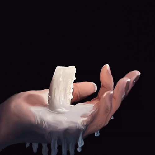 a hand with blue gloves holds ice and foam on it