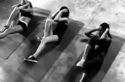 three people lay on separate mat doing exercises