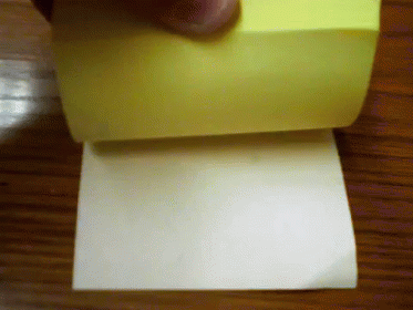 a person is moving along a rolling up piece of paper
