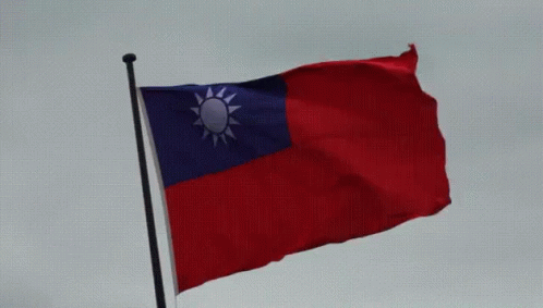a chinese flag flying in the wind