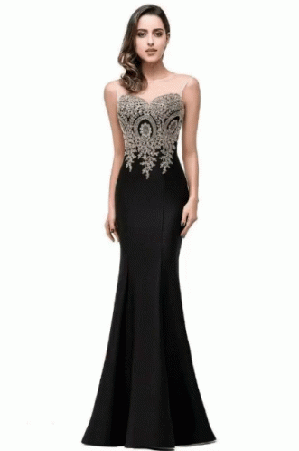 the long dress is black with a lace - detailed bouncy top and a low back