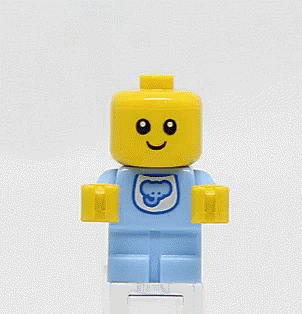a small lego person with a smile on his face