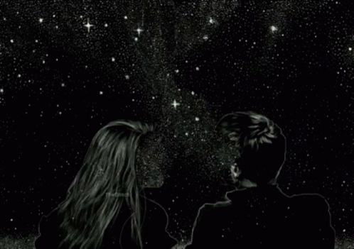 a couple under the stars on a dark night