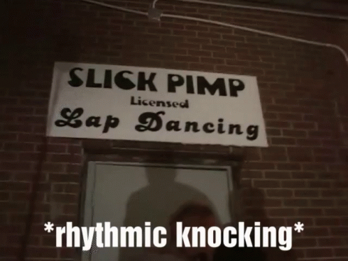 a sign advertising a dancing performance outside a brick building