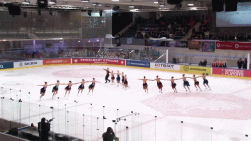 hockey team performing stunts on the ice at an event