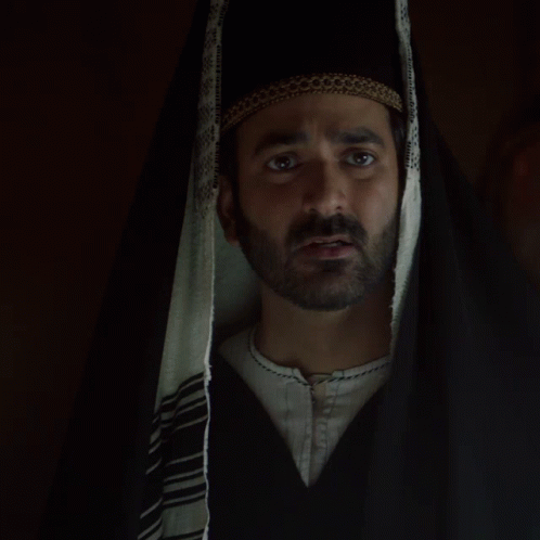 a man in a hooded hood with one eye open