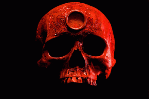 the skull is painted blue, the background is black