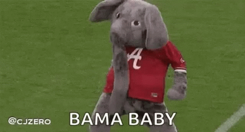 an elephant mascot with it's head in the air
