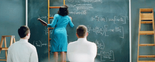 a woman is on a ladder and writing on the blackboard