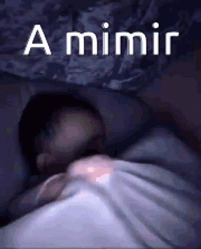 a small child sleeps in a cave underneath a cliff