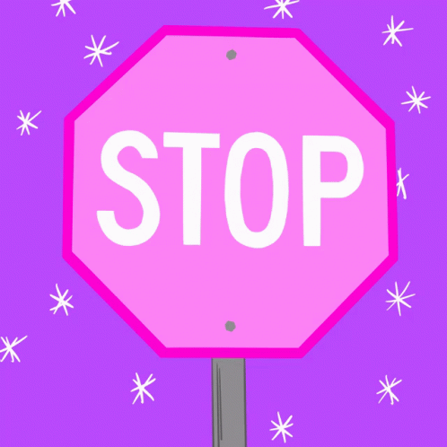 a purple stop sign is standing with snowflakes on pink