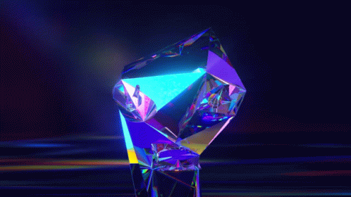 a brightly colored crystal standing in the darkness