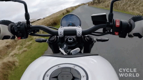 a motorcycle front handlebars are shown with no background