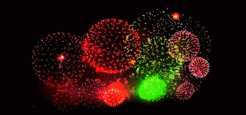a group of fireworks lit up at night