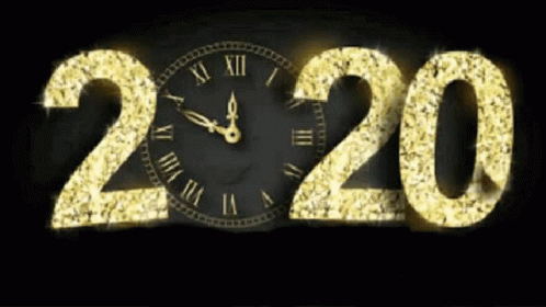 an image of a clock in the dark next to the year
