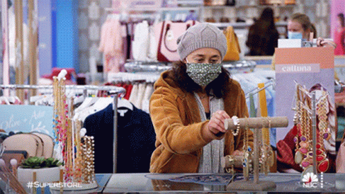 a person in a store wearing a face mask