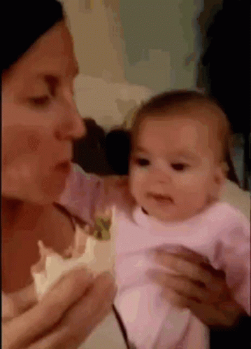 a woman and her baby talking to each other