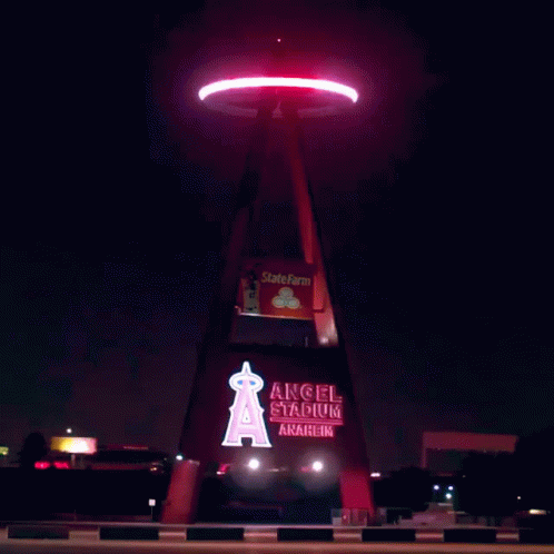 an illuminated sign with the words angel stadium at night