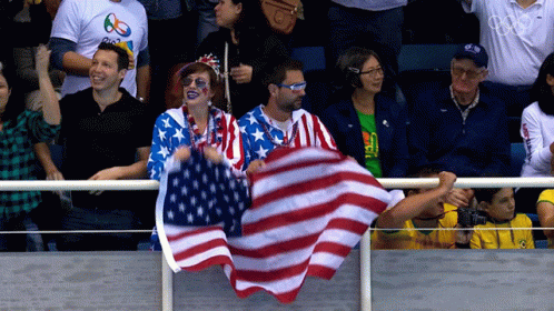 a woman with flag on a table at a sports event