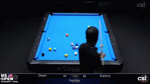 a man playing a game of pool while someone looks on