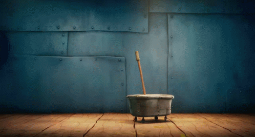 an artistic po of a bucket and a broom