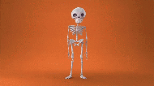 the skeleton is standing alone, posing for the camera