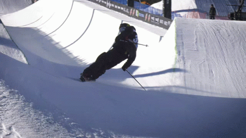 a skier going down the slope while riding